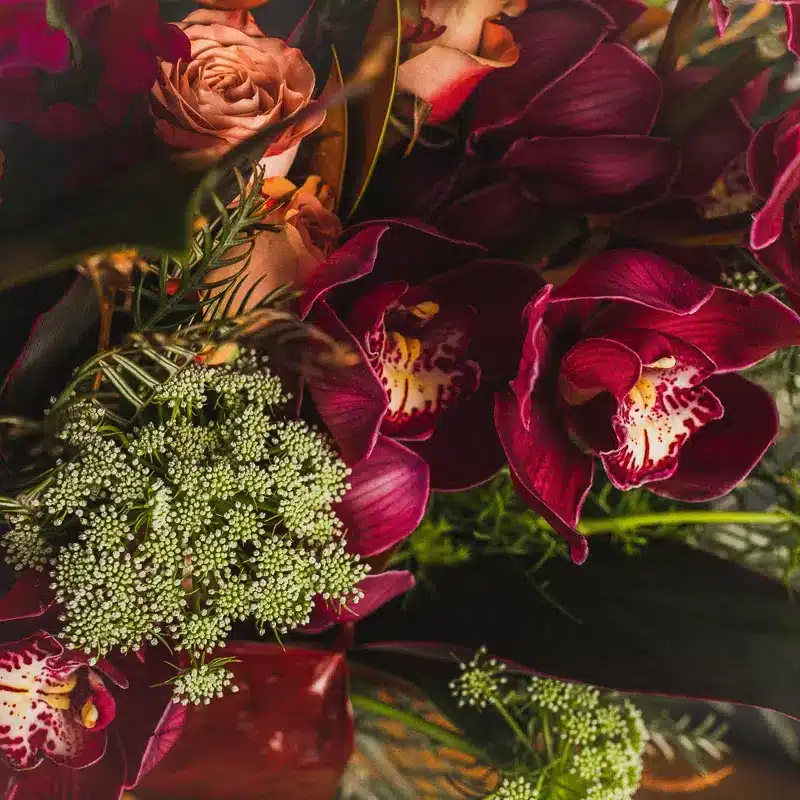 Deep red and peach roses with greenery - The Village Florist Hunters Hill