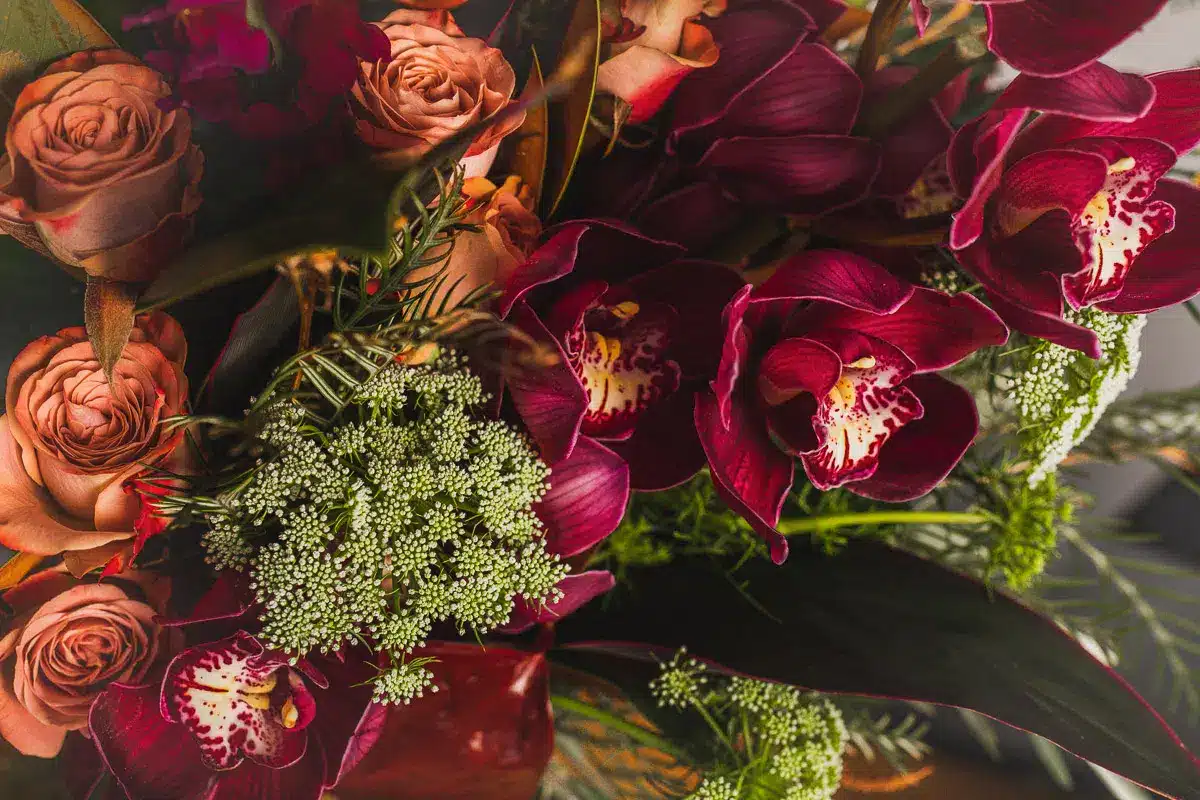 Deep red and peach roses with greenery - The Village Florist Hunters Hill