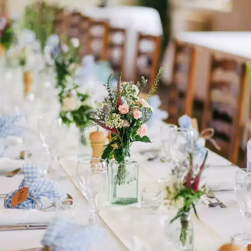 Table setting with flowers and blue gingham - The Village Florist Hunters Hill