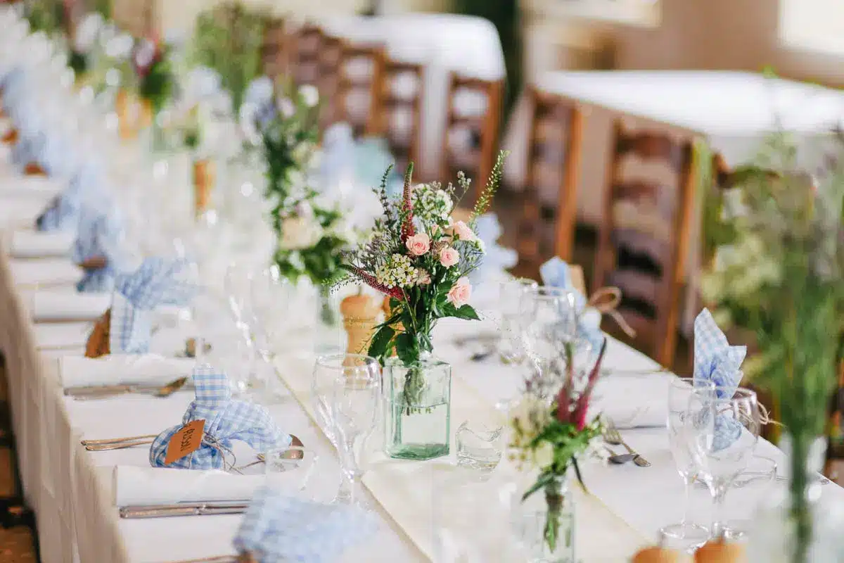 Table setting with flowers and blue gingham - The Village Florist Hunters Hill