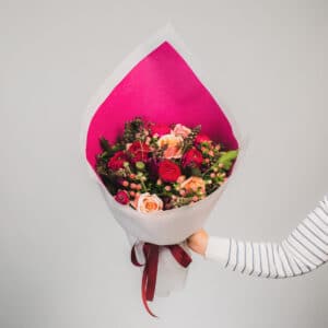 Bright red and pink floral bouquet with roses and berries. - The Village Florist Hunters Hill
