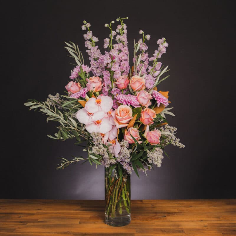 Pastel flower arrangement with pink roses and orchids. - The Village Florist Hunters Hill