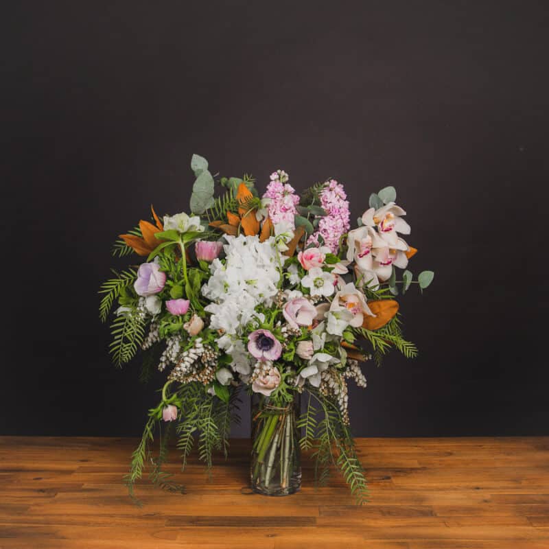 Pale pink and white floral arrangement with orchids and eucalyptus. - The Village Florist Hunters Hill