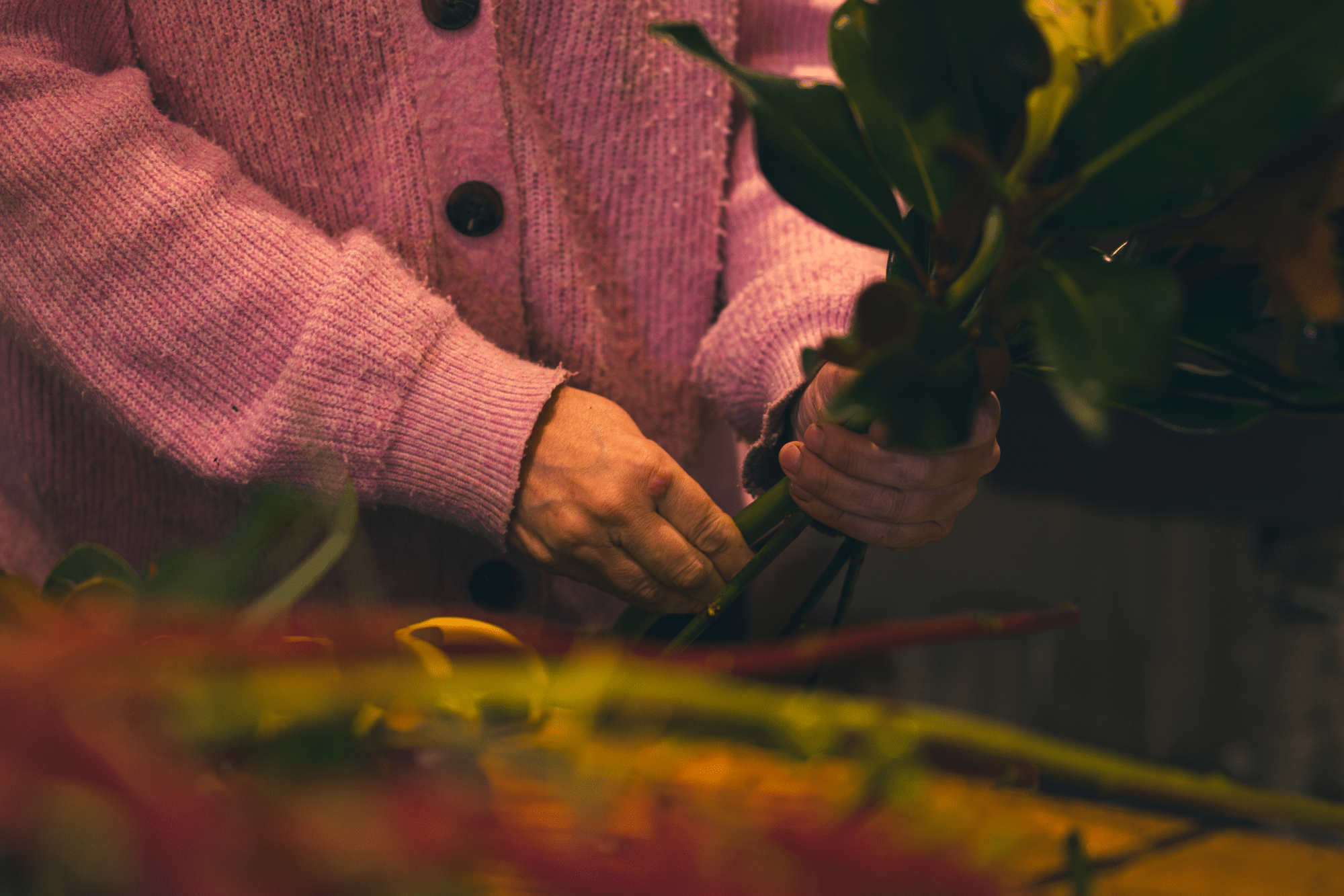 Hands arranging flowers - The Village Florist Hunters Hill
