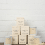Cream scented candles with floral names like Sweet Pea and Geranium. - The Village Florist Hunters Hill